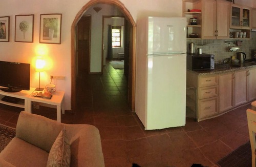 Kayakoy Cottage | Traditional stone cottage with stunning garden in historic Kaya village.