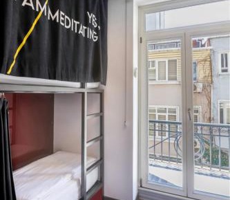 Bed in 4-Bed Dormitory Room with Shared Bathroom