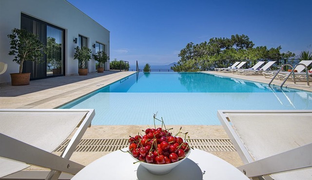 A 6-bedroom private, waterfront villa with an outdoor pool. Rents per week.