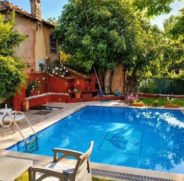Stone mansion with private pool and garden and authentic village house in Kuşadası